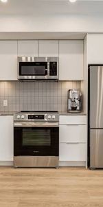 Open-concept kitchen, Quartz countertops, In-suite laundry - Photo 4