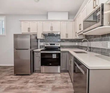 All Utilities Included Separate Laundry Bright 2 Bed Suite with Lar... - Photo 1