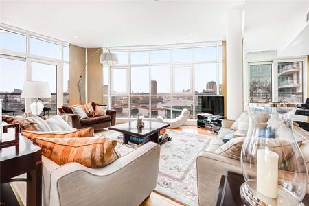 A stunning, unique three bedroom apartment with 180 degree river views in St George Wharf. - Photo 2