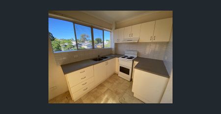 Spacious unit with lock up garage - Photo 5