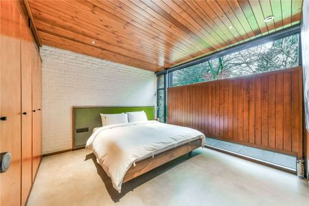 Nestled within a prestigious secluded private road in Blackheath, this striking family home stands as a testament to contemporary luxury and sustainability. Spanning 1197 square feet. - Photo 5