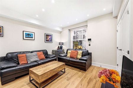 This stunning two-bedroom apartment is located on the lower ground floor of a beautifully restored period conversion house, offering the perfect blend of classic charm and modern comfort. - Photo 2