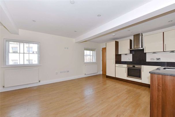 Centrally located one bedroom top floor apartment. One allocated parking space included. - Photo 1