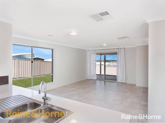 FAMILY HOME IN BOOROOMA - Photo 1