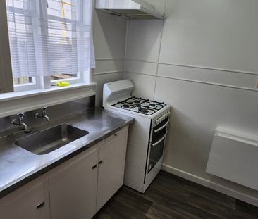 Step inside this self contained one-bedroom unit. - Photo 4