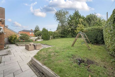 An immaculately presented four-bedroom detached family home with garaging. - Photo 2