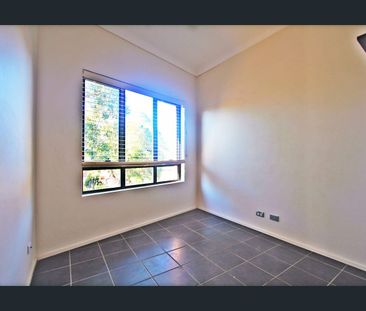 Full Brick Townhouse of Two Bedroom One Bathroom with Garage! - Photo 4