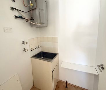Newly Renovated Top Floor Unit - Photo 6