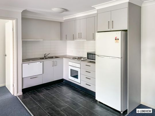 Perfectly Positioned Unit - white goods included! - Photo 1