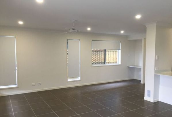 Modern Family Home with Multiple Living Areas in Convenient Bellbird Park Location - Photo 1