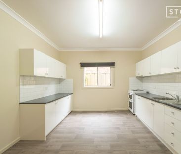 Two bedroom home with lawn maintenance included - Photo 1