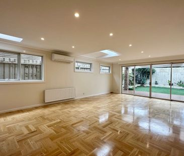 ARCHITECTURALLY DESIGNED TOWNHOUSE IN THE MCKINNON SCHOOL ZONE - Photo 1