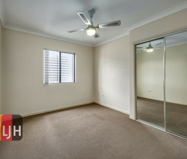 TOP FLOOR THREE BEDROOM UNIT WITH DOUBLE GARAGE & LARGE DECK! - Photo 6