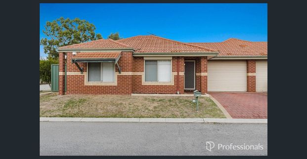 Low maintenance living. - Photo 1