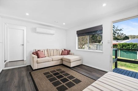 Family home with multiple living zones and large fenced yard - Photo 2