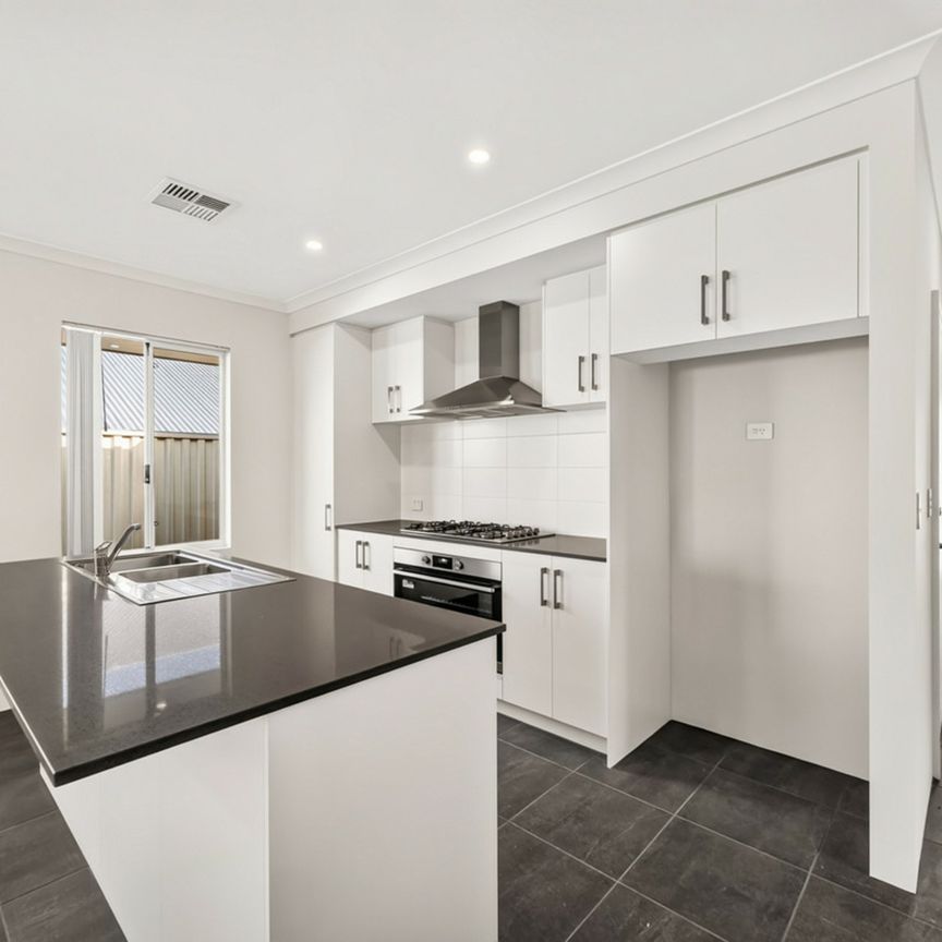 Brand New Fully Landscaped Four-Bedroom Home! - Photo 1
