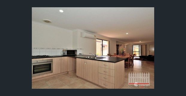 PERFECTLY POSITIONED FOUR BEDROOM HOME - Photo 1