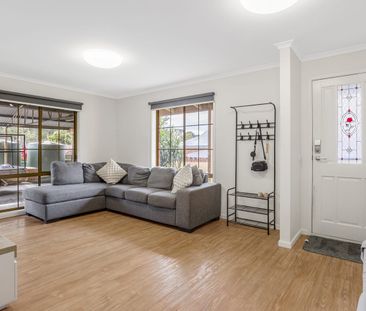 Elegant, Low-Maintenance Living in a Prime Golden Square Location - Photo 1