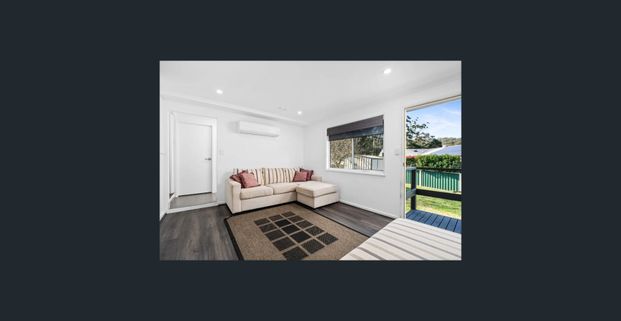 Family home with multiple living zones and large fenced yard - Photo 1