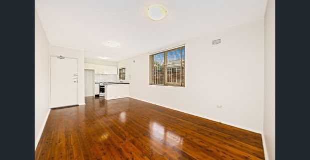 Sun-Filled Apartment with Parking in Lifestyle Location - Photo 1