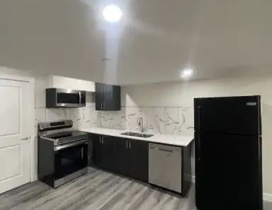 New, recently developed Walk-out basement suite with huge green space area | Calgary - Photo 1