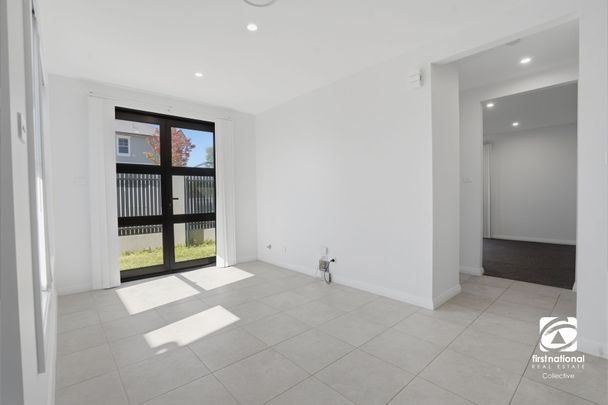 Stylish Townhouse in Sought-After Estate with Bushland Views - Photo 1