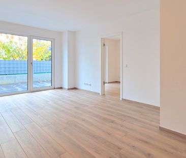 Moderne EG-Wohnung mit Terrasse, hochwertiger Ausstattung und großen Keller in zentraler Lage - Photo 2