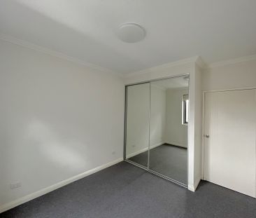 Brand new carpet, three bright rooms with windows, and two parking ... - Photo 4