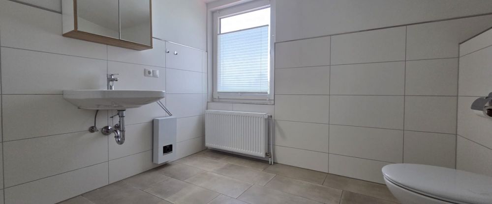 Traumhafte Obergeschosswohnung – modern, lichtdurchflutet und nur wenige Minuten vom Meer entfernt - Foto 1