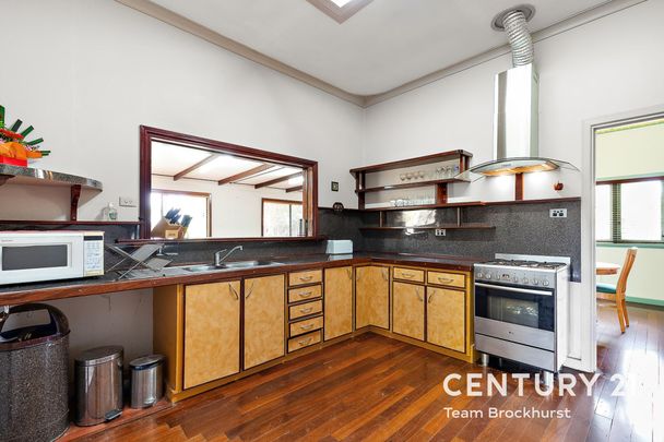 Charming 1950s Home with Modern Flexibility & Pristine Gardens! - Photo 1