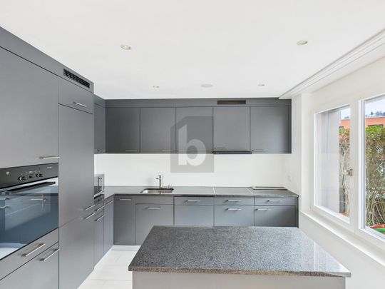 HIGH-QUALITY AND STYLISH WITH A SUNNY SEATING AREA! - Photo 1