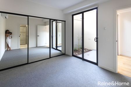 Architectural Townhouse In Brunswick Awaits - Photo 3