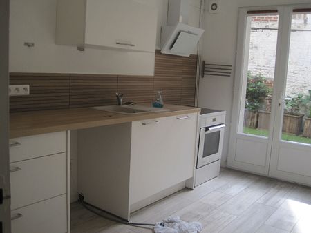 A LOUER APPARTEMENT EN RDC PROCHE CENTRE VILLE DE ST QUENTIN 02100 - Photo 4