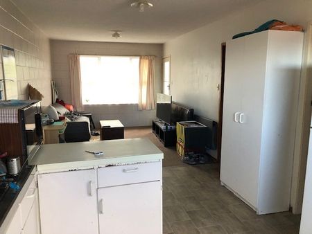 Tidy and spacious, this one-bedroom upstairs flat sits in a quiet block of six and is just a short walk from Waikato University — making day-to-day living super convenient. - Photo 2