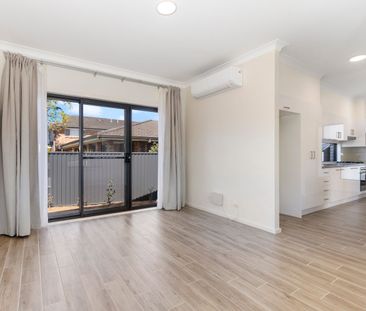 Stylish Near-New 2-Bedroom Home with Spacious Outdoor Living - Photo 1