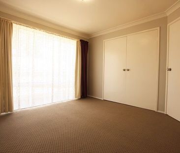 Neat and tidy Family Home- with a perfect yard - Photo 1