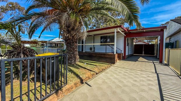 Charming Family Home in Convenient Location - Photo 1
