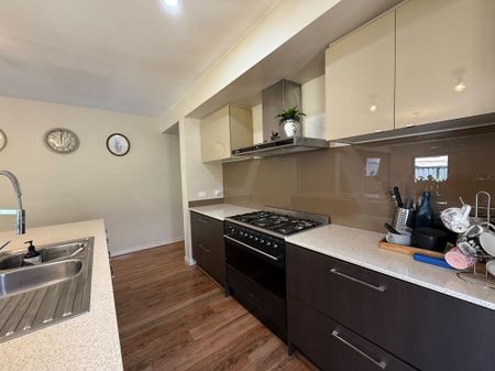 Spacious 4-Bedroom Home with Two Living Areas and Modern Upgrades - Photo 3