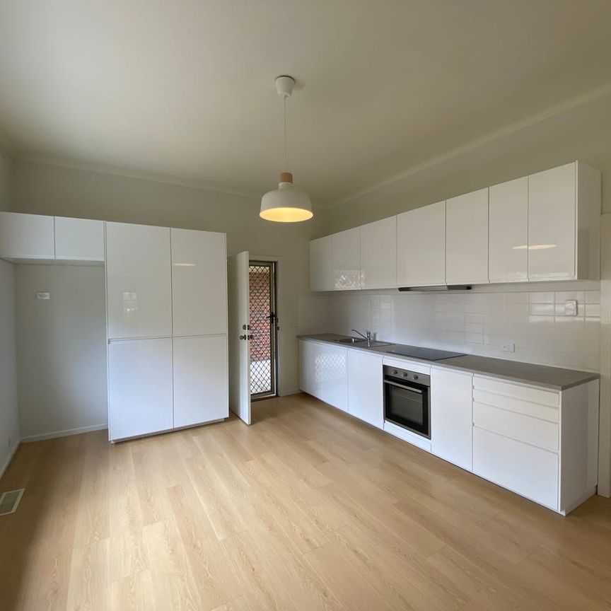 Low maintenance living in ideal location - Photo 1