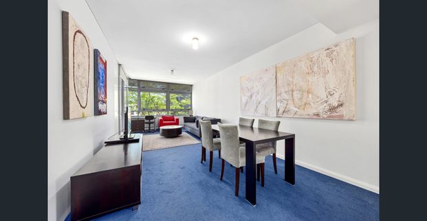 Fully furnished Harborside living with bright Interiors & prime location - Photo 1