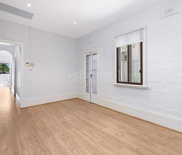 Stunning Renovated 2 Bedroom Home + Spacious Attic in Premier Location - Photo 3