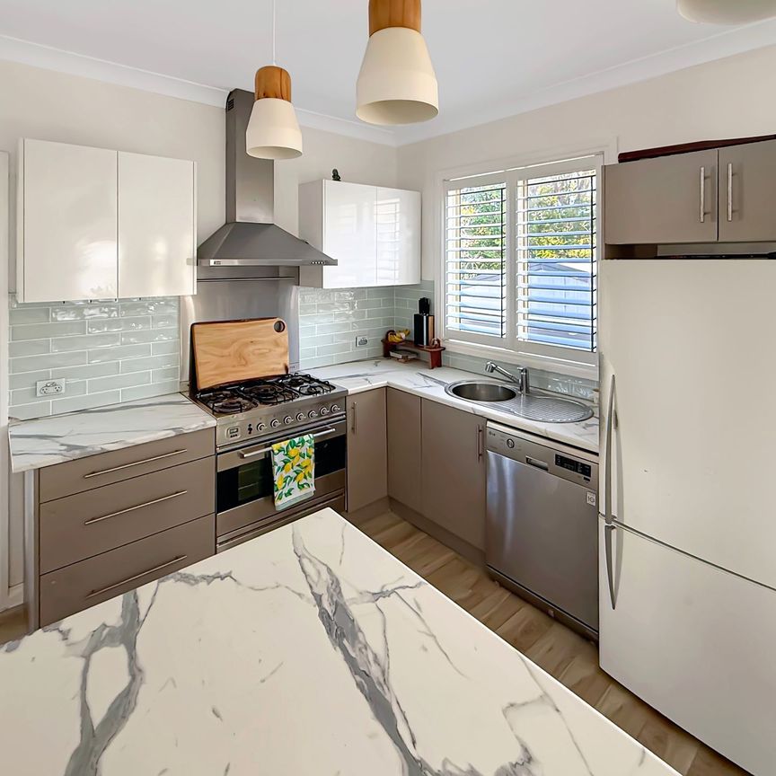 STYLISH RENOVATED 3 BEDROOM FAMILY HOME - Photo 1