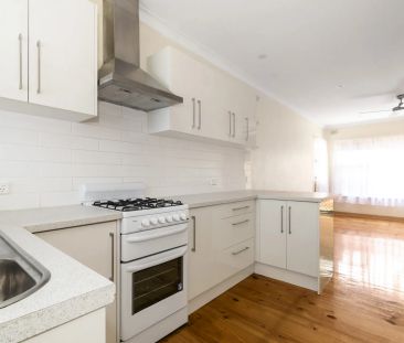Stylish & Convenient Two-Bedroom Living By The Beach - Photo 1