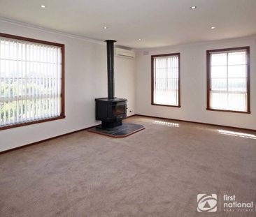 Sitting Amongst the Flowers - Photo 1