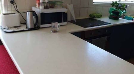 Spacious Family Oasis: 5-Bedroom Home with Self-Contained Sleepout & Expansive Lawn - Photo 5