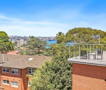 Top floor one bedroom apartment with glimpse of water views - Photo 1