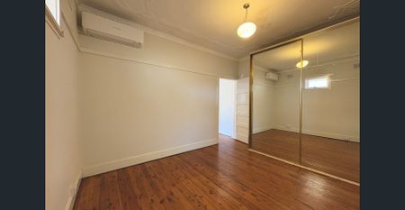 Walk to Eastwood Station – Full-Brick 4 Bedroom Home - Photo 3