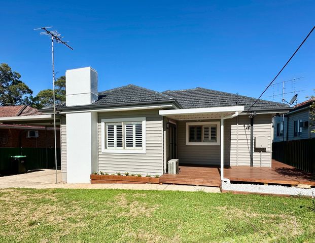 Fully Renovated Three-Bedroom Home with Carport Parking - Photo 1