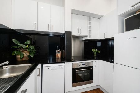 Renovated Beachside Pad with Art Deco Flair - Photo 3