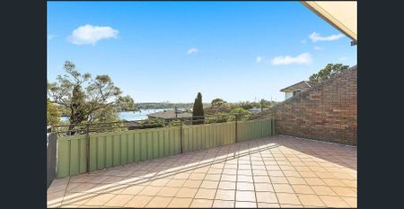 Sunsoaked & Spacious Two Bedroom Townhouse-Style Apartment with Water Views - Photo 5